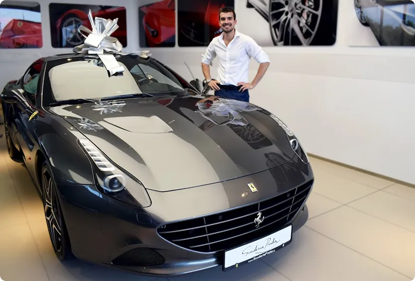 Giulio being given a Ferrari for exceptional sales performance